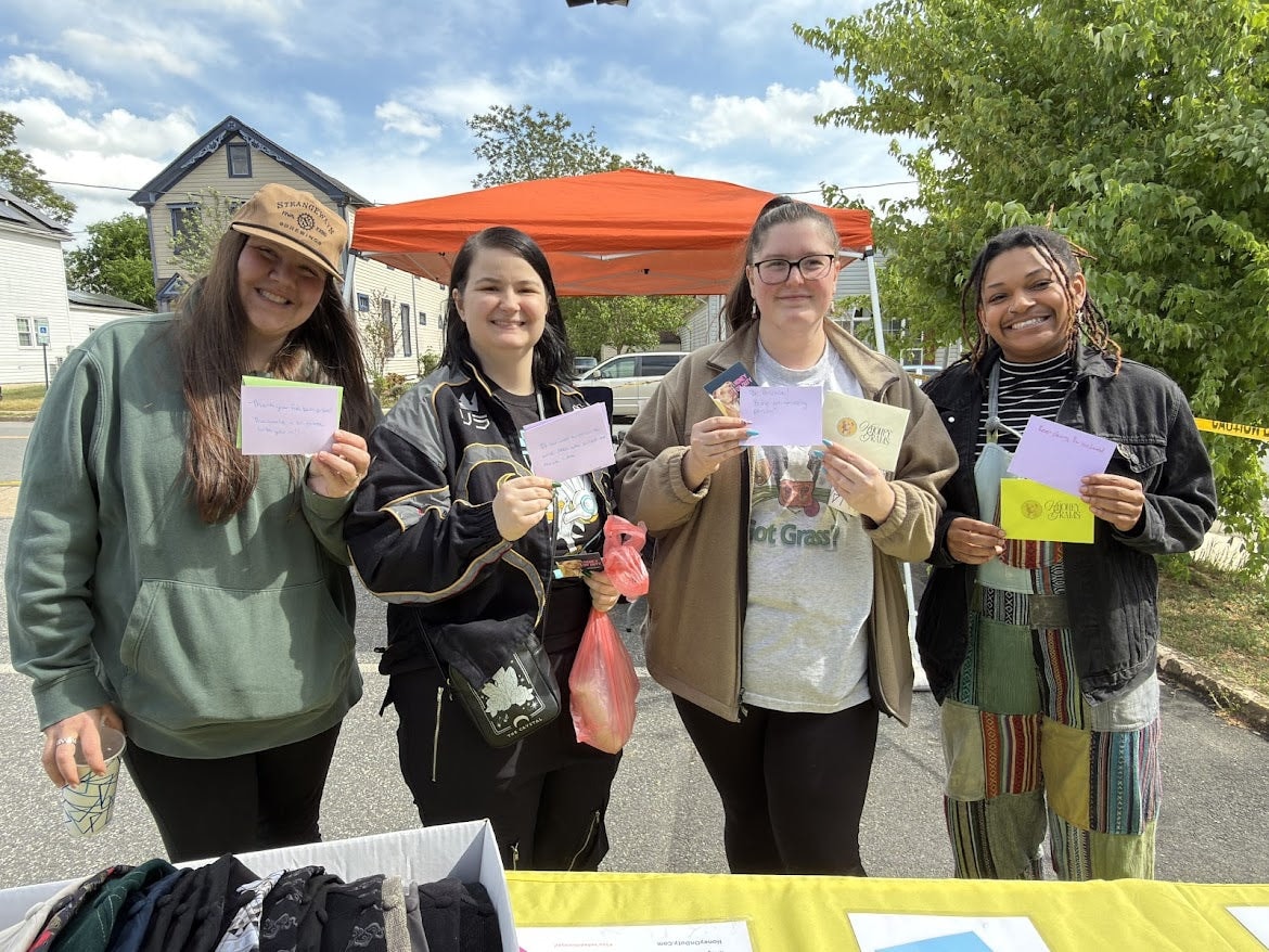 Honey's Dog Treats team at a community market event