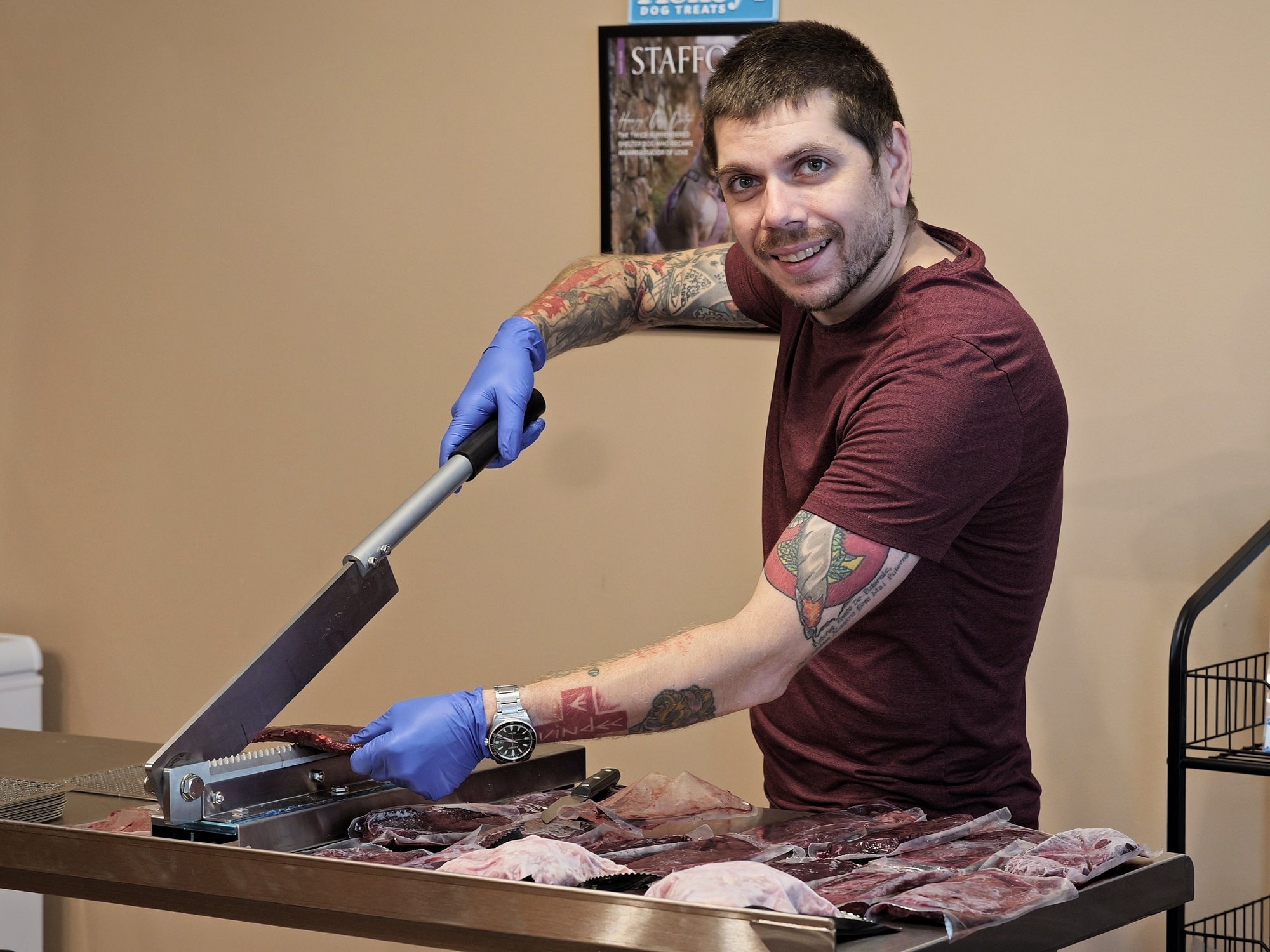 Stefan preparing single-ingredient beef pizzle in Honey's Small Kitchen with Honey by his side