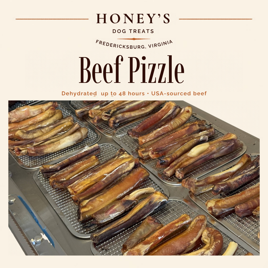 Traditional dehydrated beef pizzles on wire dehydrator racks in Honey's Small Kitchen — golden, natural finish