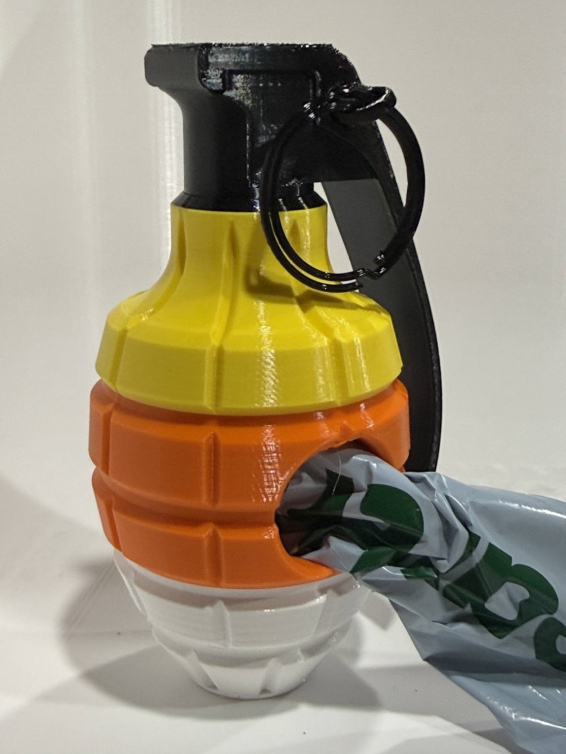 Candy Corn Poop Bag Dispenser angled view showing pull-pin ring and lever mechanism